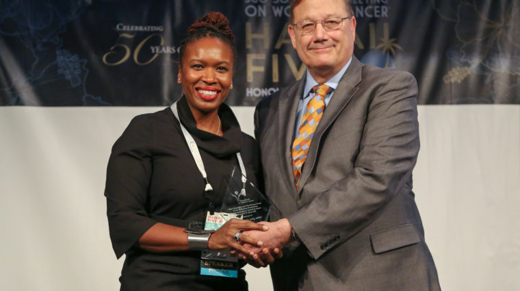 Leeya Pinder, MD, MPH, recipient of the Nina Donnelley and The Dickens Fund of the Donnelley Foundation Young Investigator Award in Honor of Laurel W. Rice, MD, with David G. Mutch, MD, FACOG, Chair of the FWC.